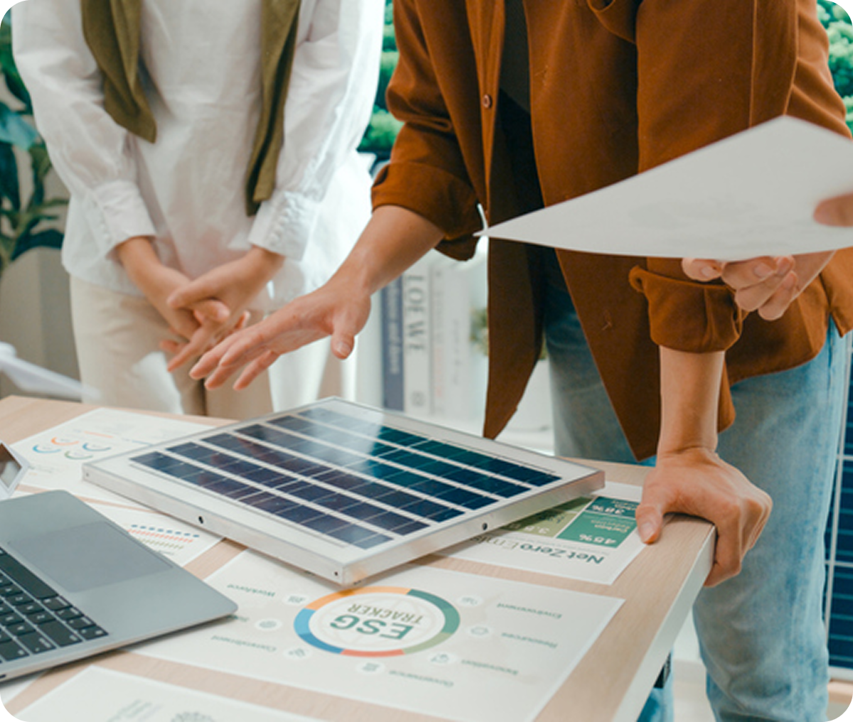 Professionals reviewing solar panel plans